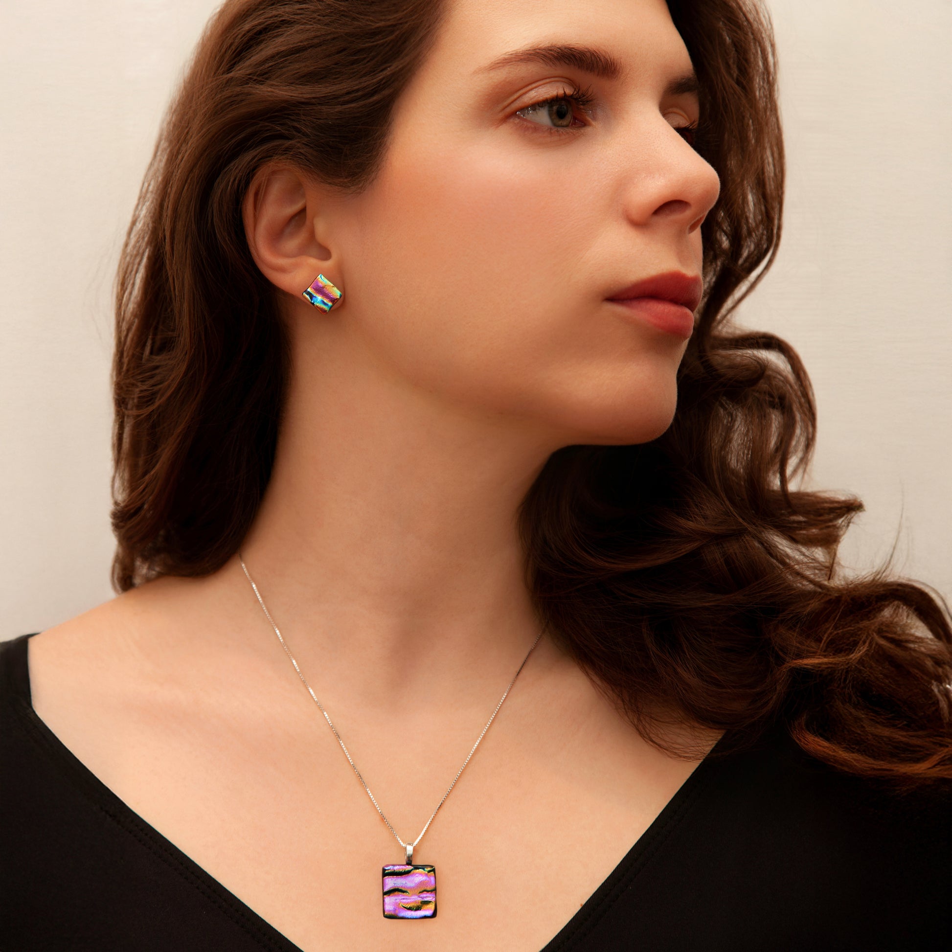 Pink ripple dichroic glass jewellery set featuring matching square stud earrings and pendant necklace. Handmade in London.