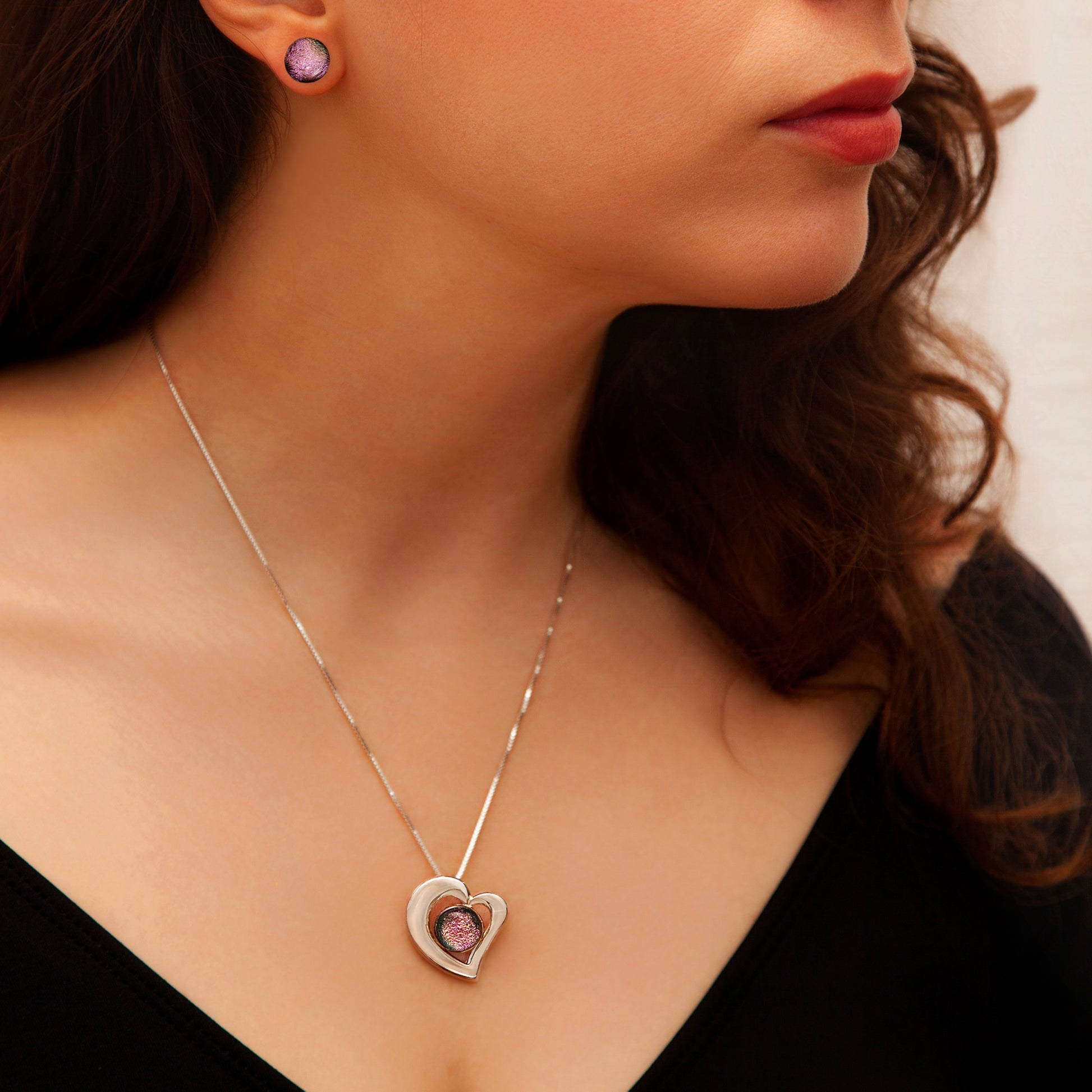 Stella jewellery set featuring pink heart necklace and matching stud earrings with shimmering dichroic glass, handmade in London.