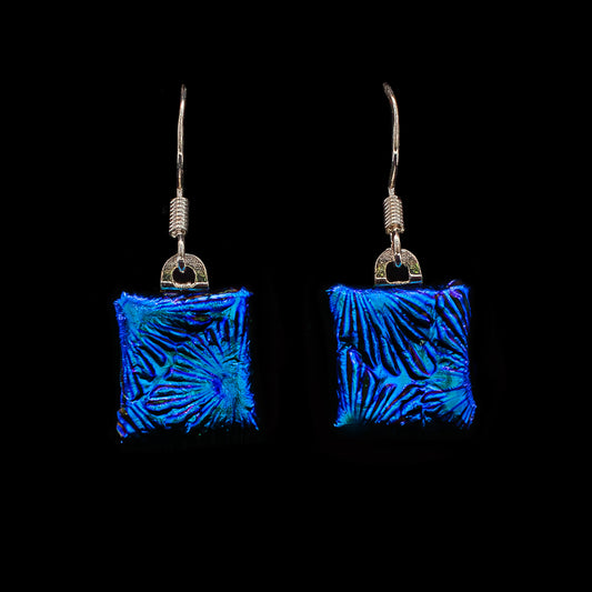 Square blue florentine dichroic glass drop earrings with textured shimmer, handmade in London by Invoke London with sterling silver hooks.