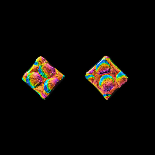 Pair of colorful square earrings on a black background