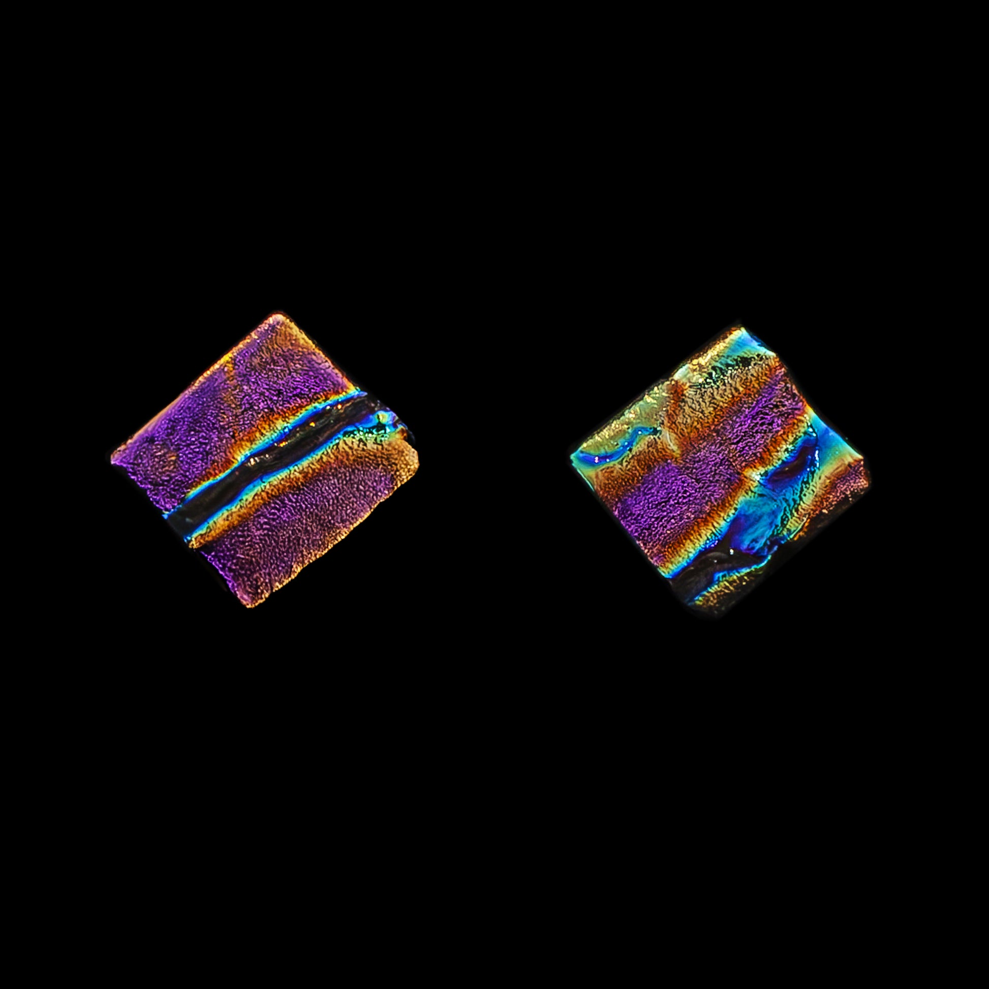 Square pink ripple dichroic glass stud earrings with shimmering texture. Handmade by Madiha Zaidi in London. Sterling silver posts.