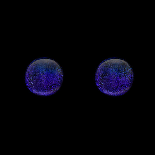 A pair of purple dichroic glass stud earrings against a black background.