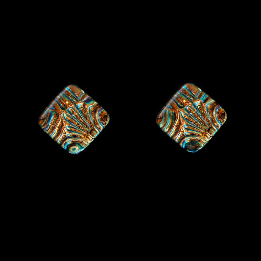 A pair of gold-florentine stud earrings with a geometric cube design, featuring dichroic glass.