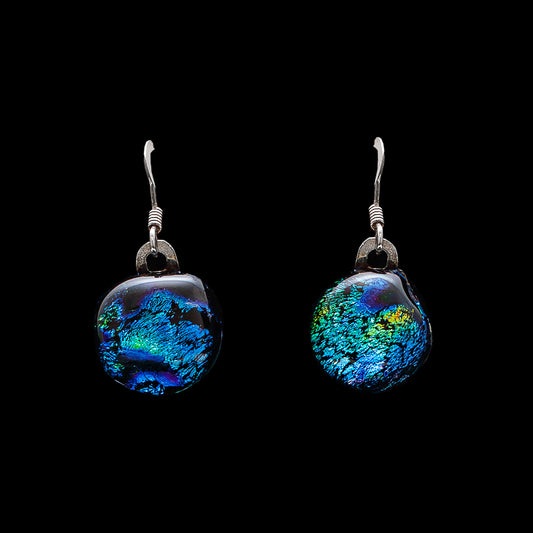Green and gold ripple dichroic glass drop earrings with sterling silver hooks, handmade in London by Madiha Zaidi.
