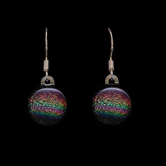 Round pink rainbow dichroic glass drop earrings, handmade in London by Invoke London with sterling silver hooks.