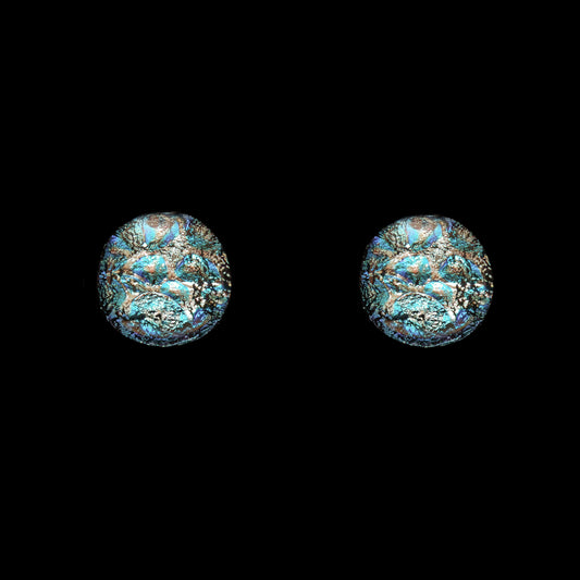 Round stud earrings in silver-toned dichroic glass with turquoise and teal highlights, handcrafted as part of the Orb Collection by Invoke London.