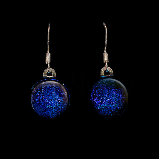 A pair of round, blue drop earrings with dichroic glass and 925 sterling silver hooks.