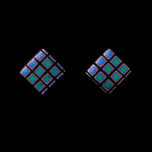 Pair of square-shaped earrings with blue squares on a black background