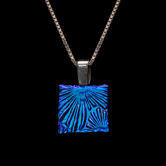 Square blue florentine dichroic glass pendant necklace, handmade in London by Invoke London on sterling silver chain.