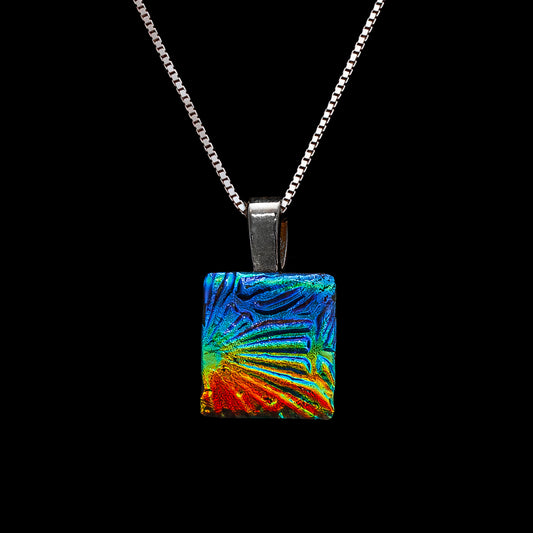 Rainbow square pendant on a silver chain against a black background