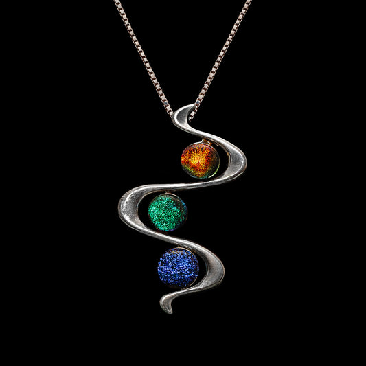 Stella Collection pendant by Invoke London with orange, green, and blue dichroic glass cabochons in a silver snake-shaped bail.