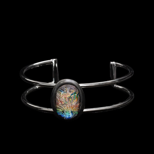 Silver bracelet with a colourful gemstone on a black background