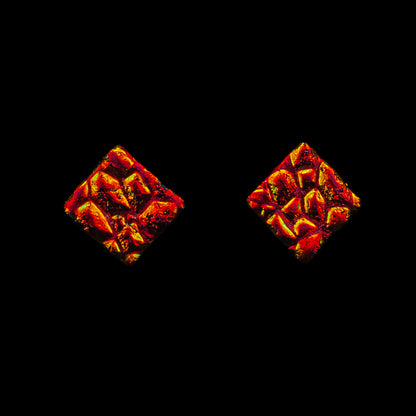 Red-orange square stud earrings with fiery glass texture modelled from the Astra Collection by Invoke London.