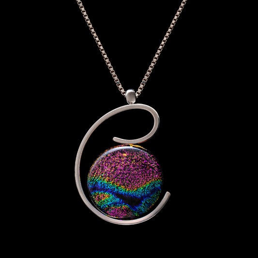 Handmade pink and blue fused dichroic glass pendant in an elegant silver spiral setting, from the Stella Collection by Invoke London.