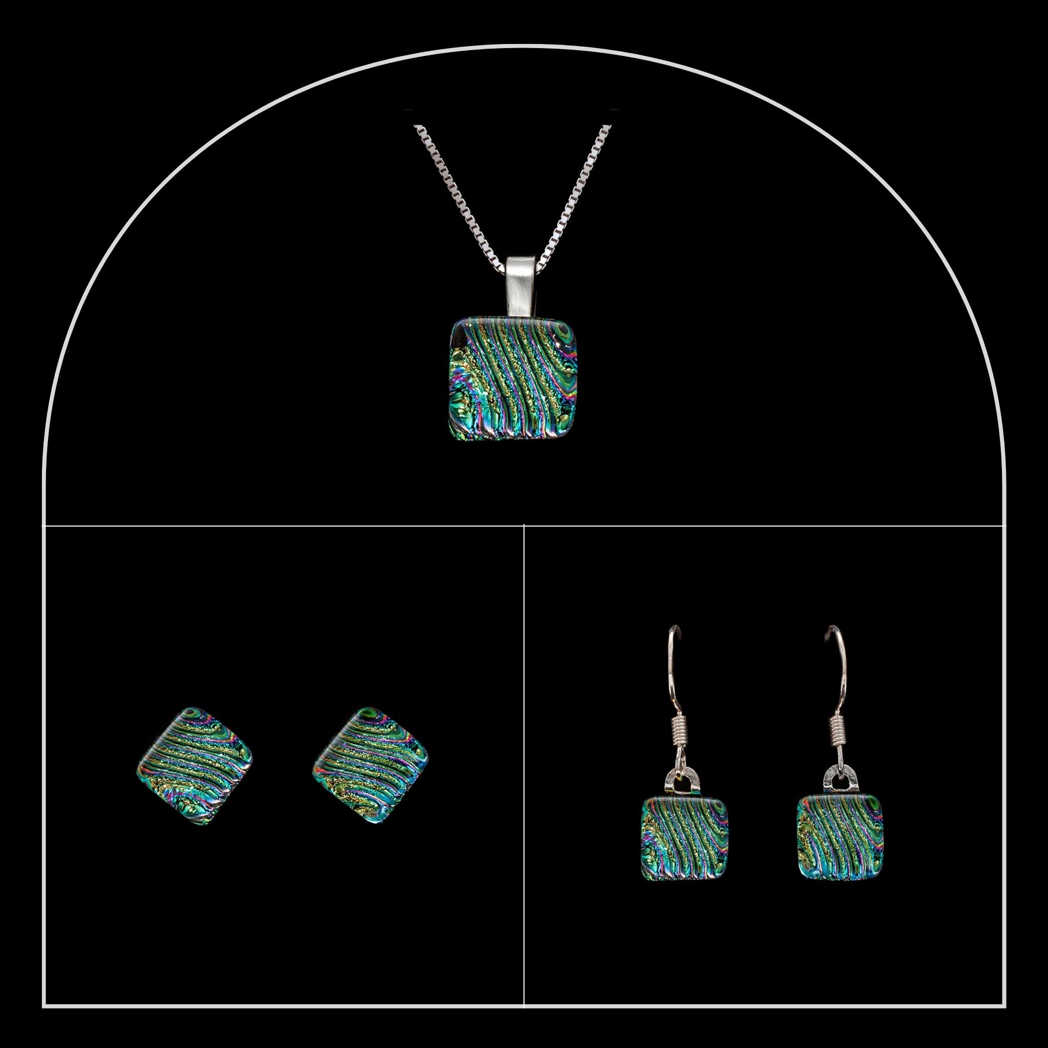 Square ripple-textured green and blue dichroic glass set from the Nova collection by Invoke London, in silver settings.