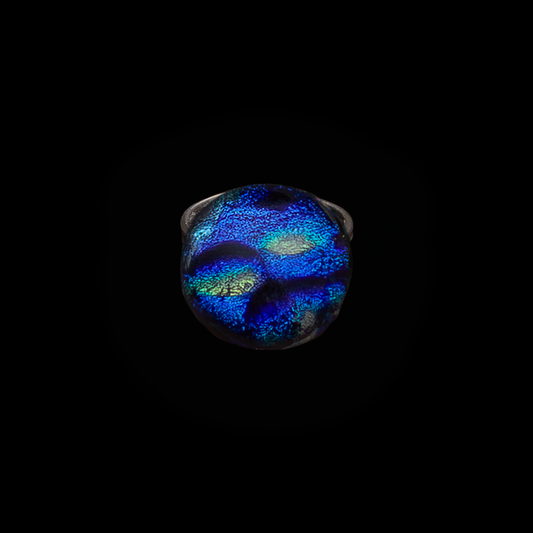 Ring with a multicolored gemstone on a black background