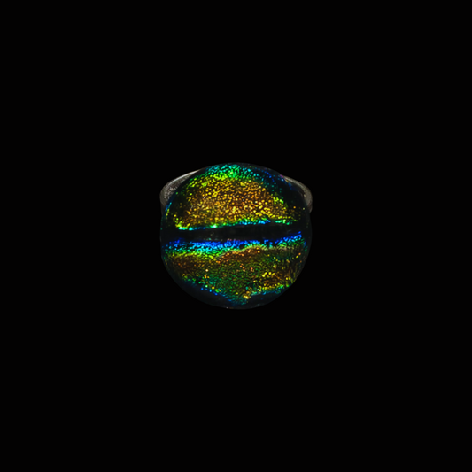 Multicolored ring with a metallic sheen on a black background