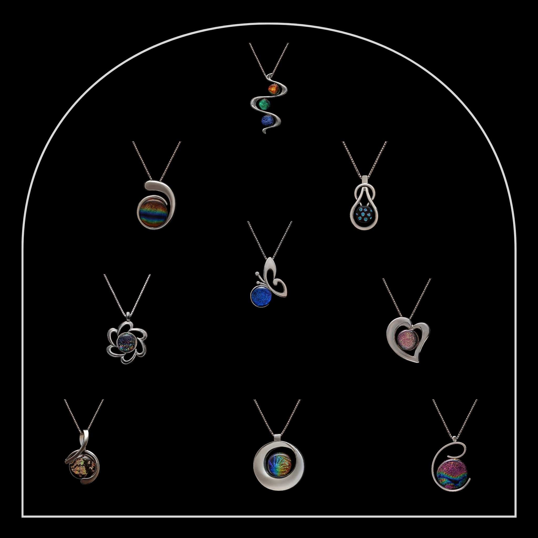 Ten handcrafted pendant necklaces from the Stella collection by Invoke London, made with dichroic glass and silver settings.